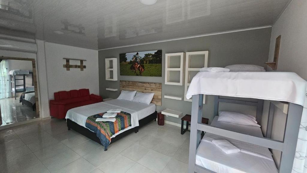 Voodi või voodid majutusasutuse Hotel - Rancho JJ toas