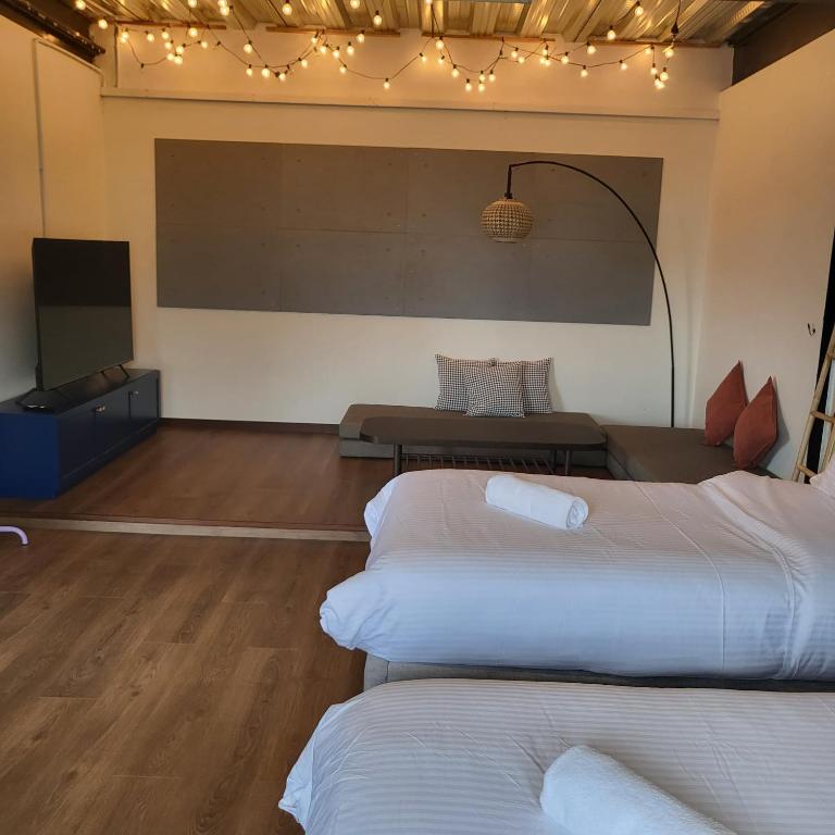 Letto o letti in una camera di kMah@SomerMansion