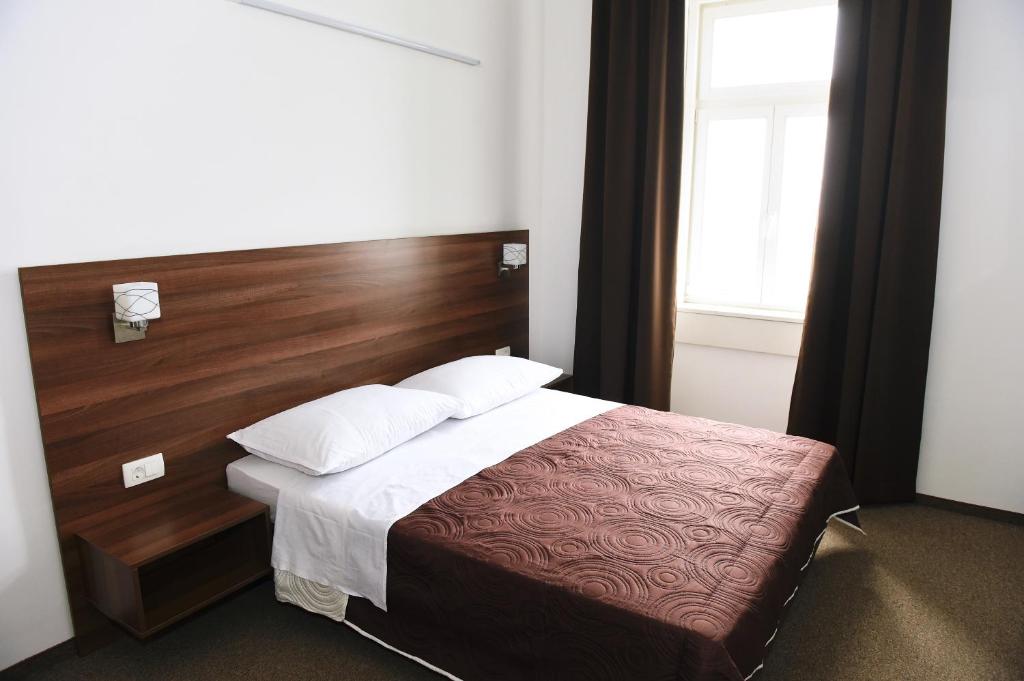 Postel nebo postele na pokoji v ubytování Riva Rooms