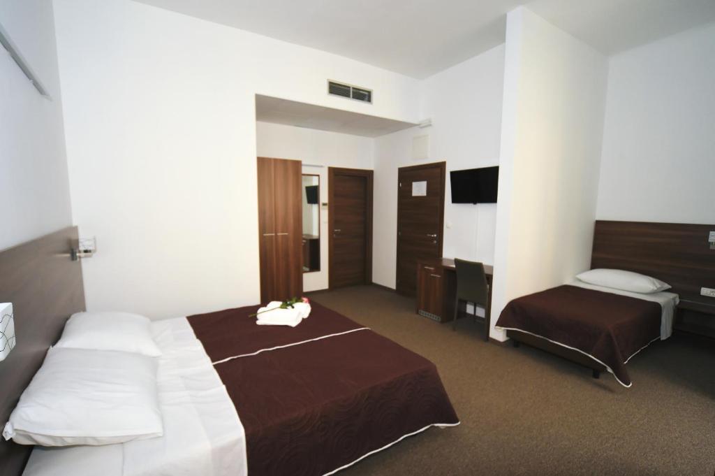 Postel nebo postele na pokoji v ubytování Riva Rooms