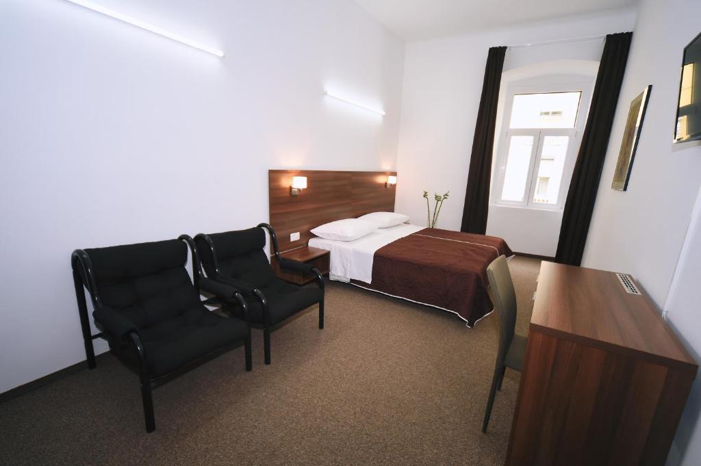 Postel nebo postele na pokoji v ubytování Riva Rooms
