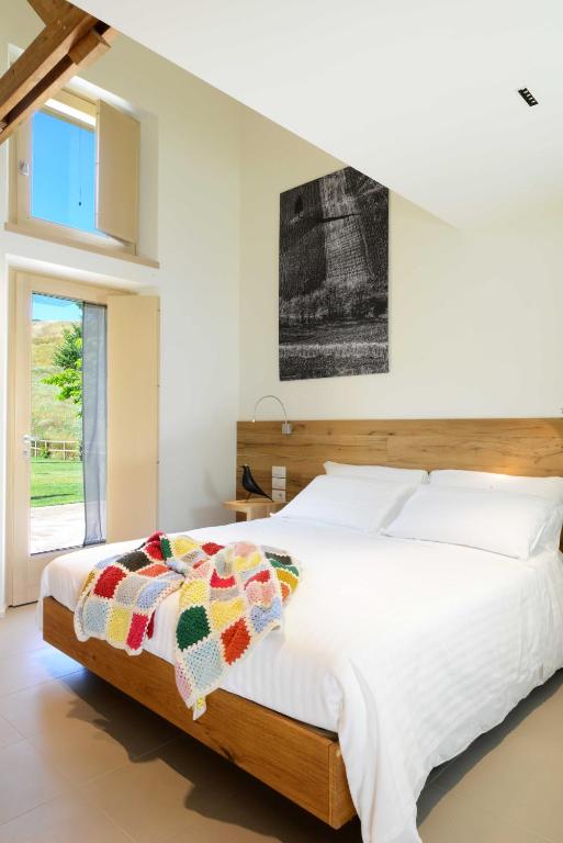 Кровать или кровати в номере Resort Il Gallo Senone