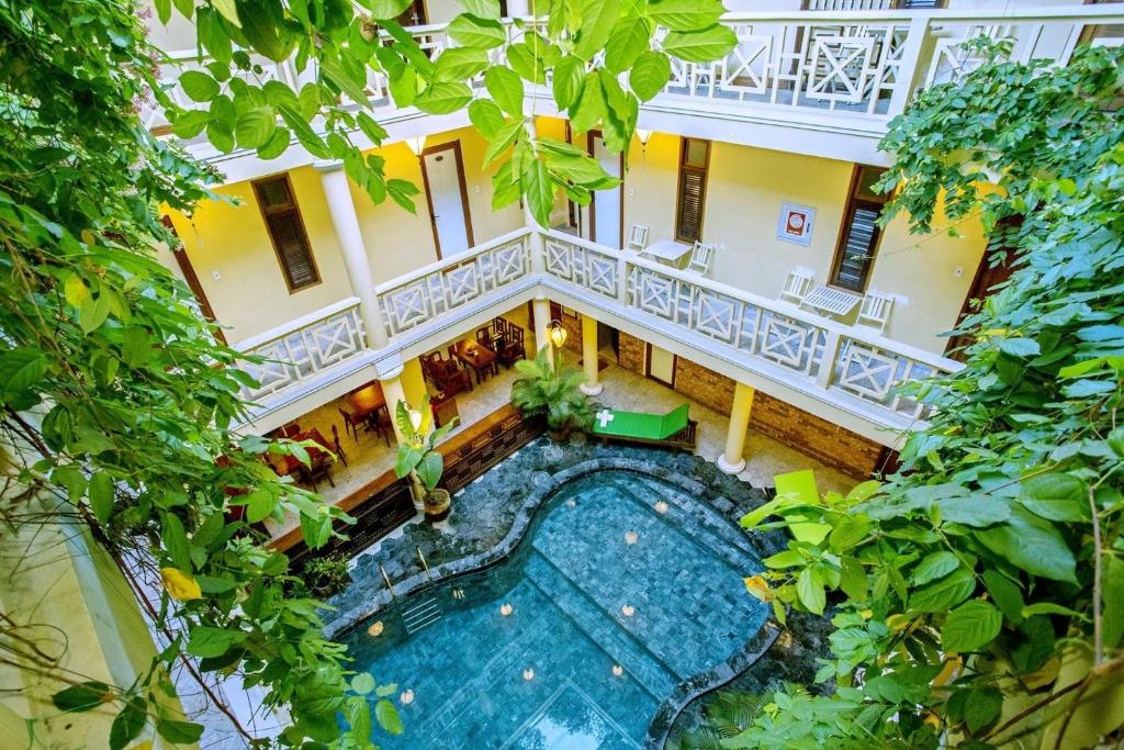 an overhead view of a swimming pool in a building at Thanh Van 1 Hotel in Hoi An