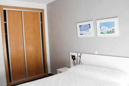 A bed or beds in a room at Apartamento turístico S