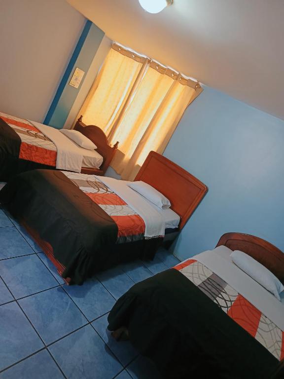 Postel nebo postele na pokoji v ubytování Hostal mariajose baños