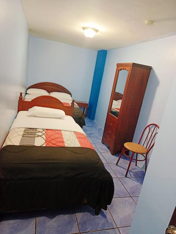 Postel nebo postele na pokoji v ubytování Hostal mariajose baños