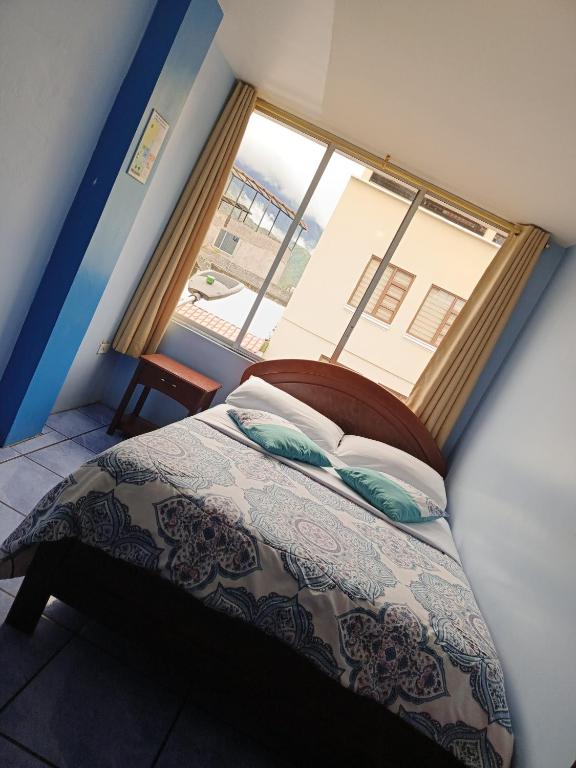 Postel nebo postele na pokoji v ubytování Hostal mariajose baños