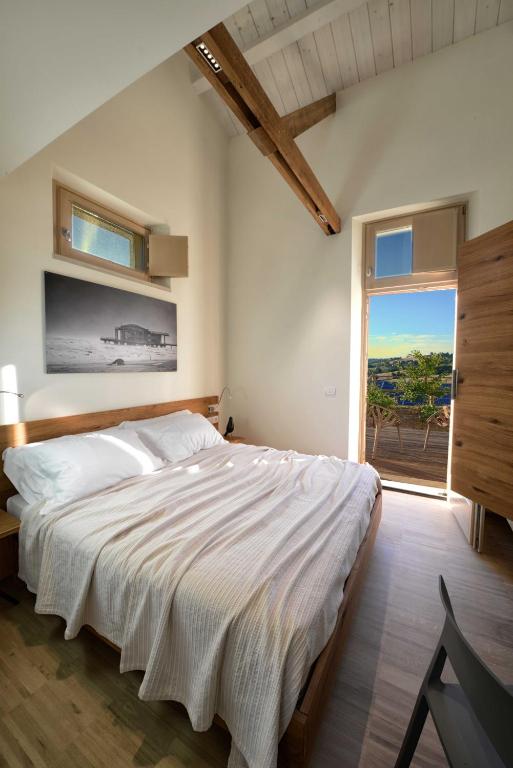 Кровать или кровати в номере Resort Il Gallo Senone
