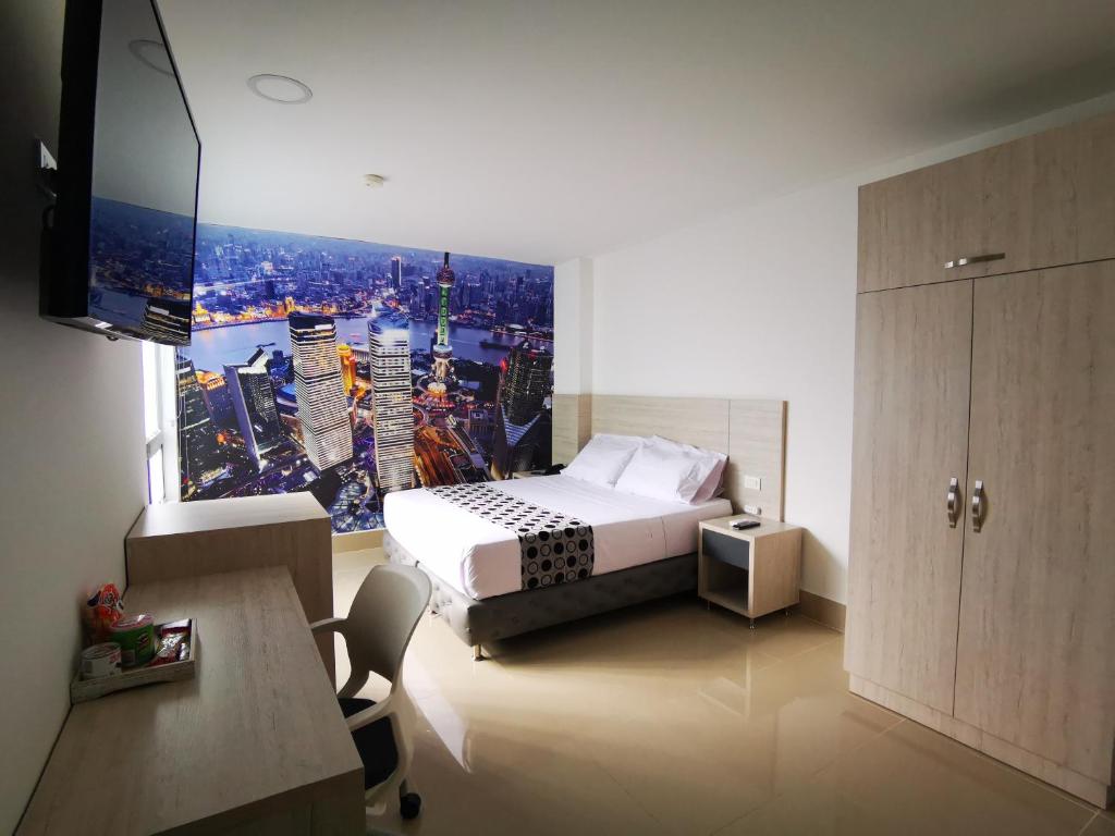 TV a/nebo společenská místnost v ubytování Hotel Lleras Express