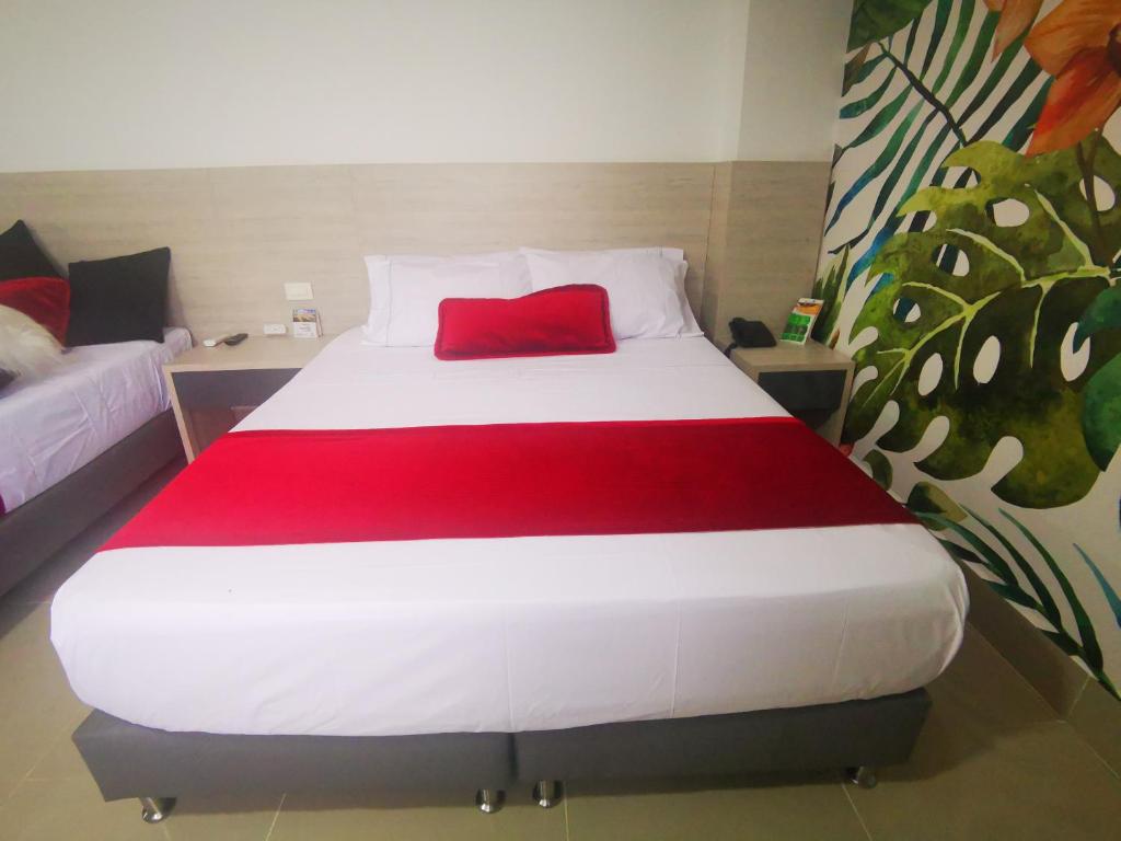 Postel nebo postele na pokoji v ubytování Hotel Lleras Express