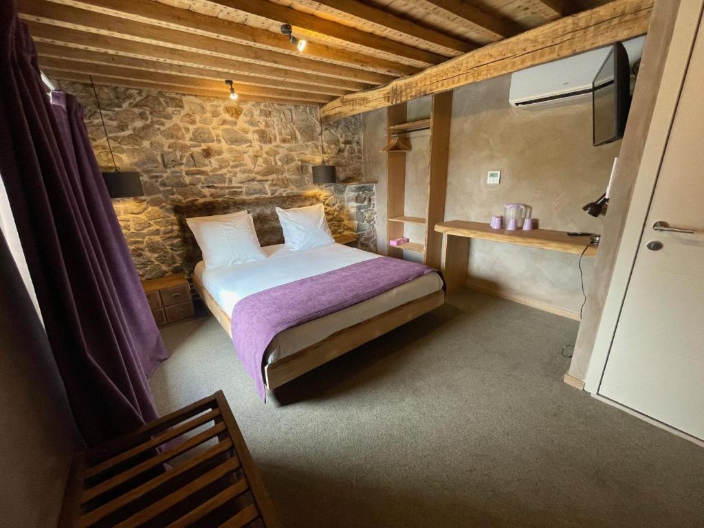 Postel nebo postele na pokoji v ubytování Les Chambres de Laurette