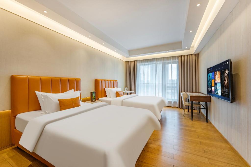 TV a/nebo společenská místnost v ubytování Raffles Executive Apartment - Guangzhou Huijin International Finance Center, Keyun Road Metro Station Branch-Canton Fair Free Shuttle