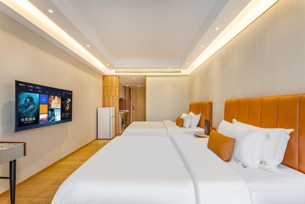 Postel nebo postele na pokoji v ubytování Raffles Executive Apartment - Guangzhou Huijin International Finance Center, Keyun Road Metro Station Branch-Canton Fair Free Shuttle