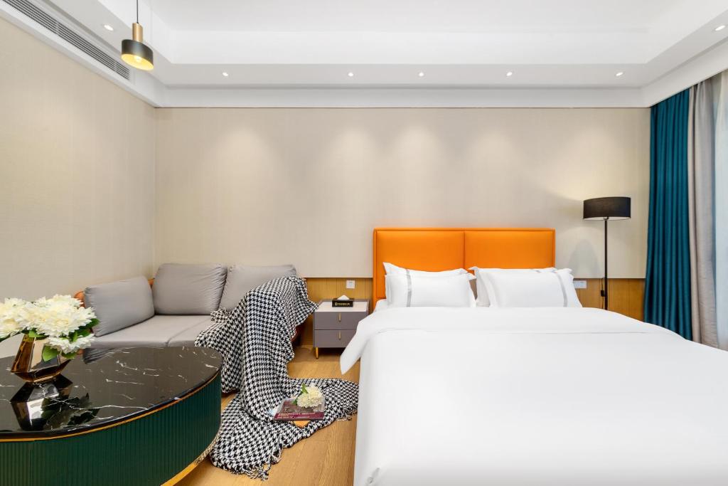 Postel nebo postele na pokoji v ubytování Raffles Executive Apartment - Guangzhou Huijin International Finance Center, Keyun Road Metro Station Branch-Canton Fair Free Shuttle