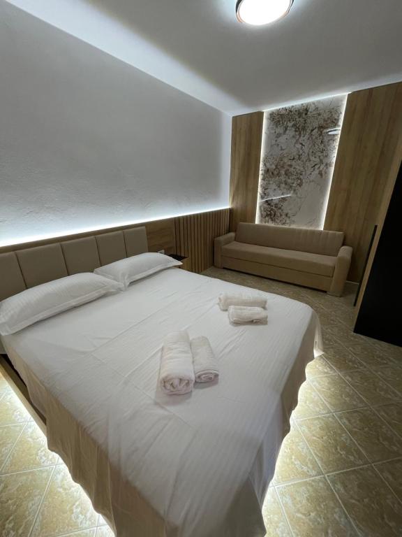 Postel nebo postele na pokoji v ubytování Hotel Riti