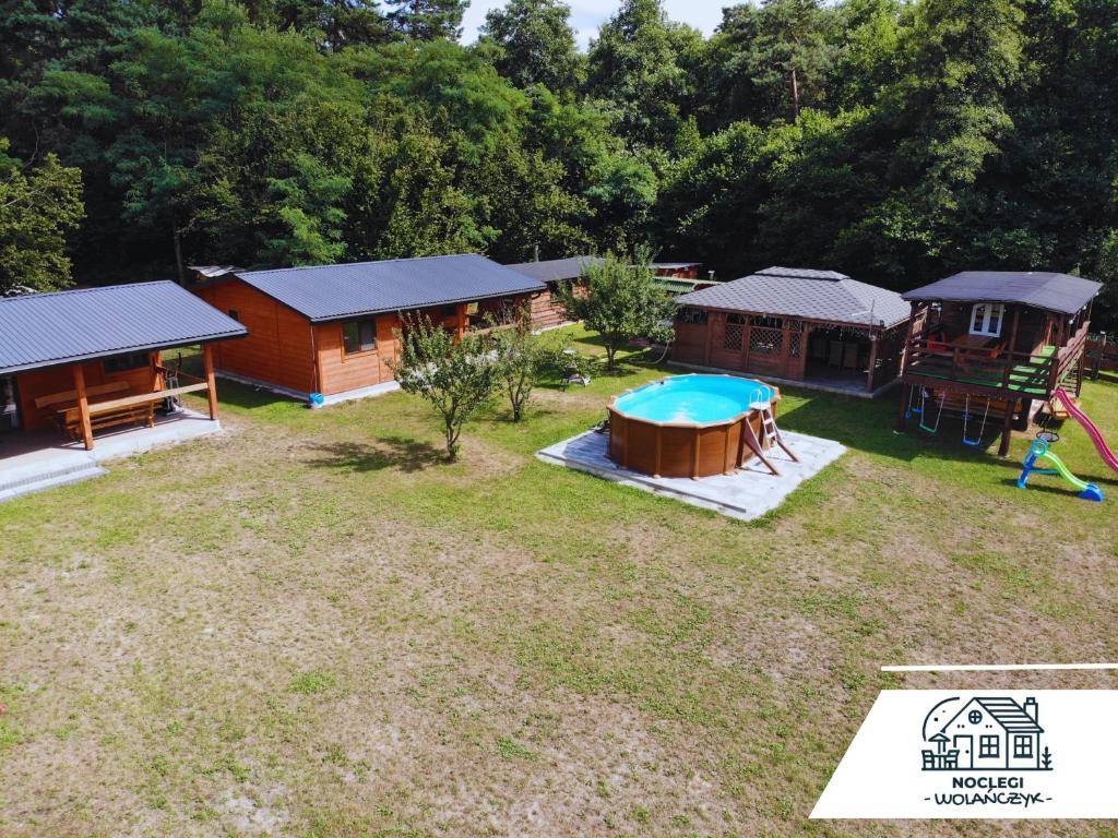 an aerial view of a backyard with a house and a playground at Wola Wielka - Domki Wygoda Nr2 in Narol