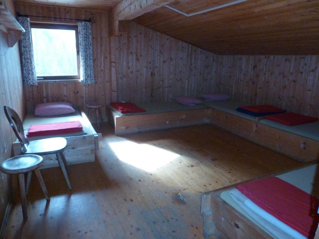 Postel nebo postele na pokoji v ubytování Binsalm- Schutzhütte