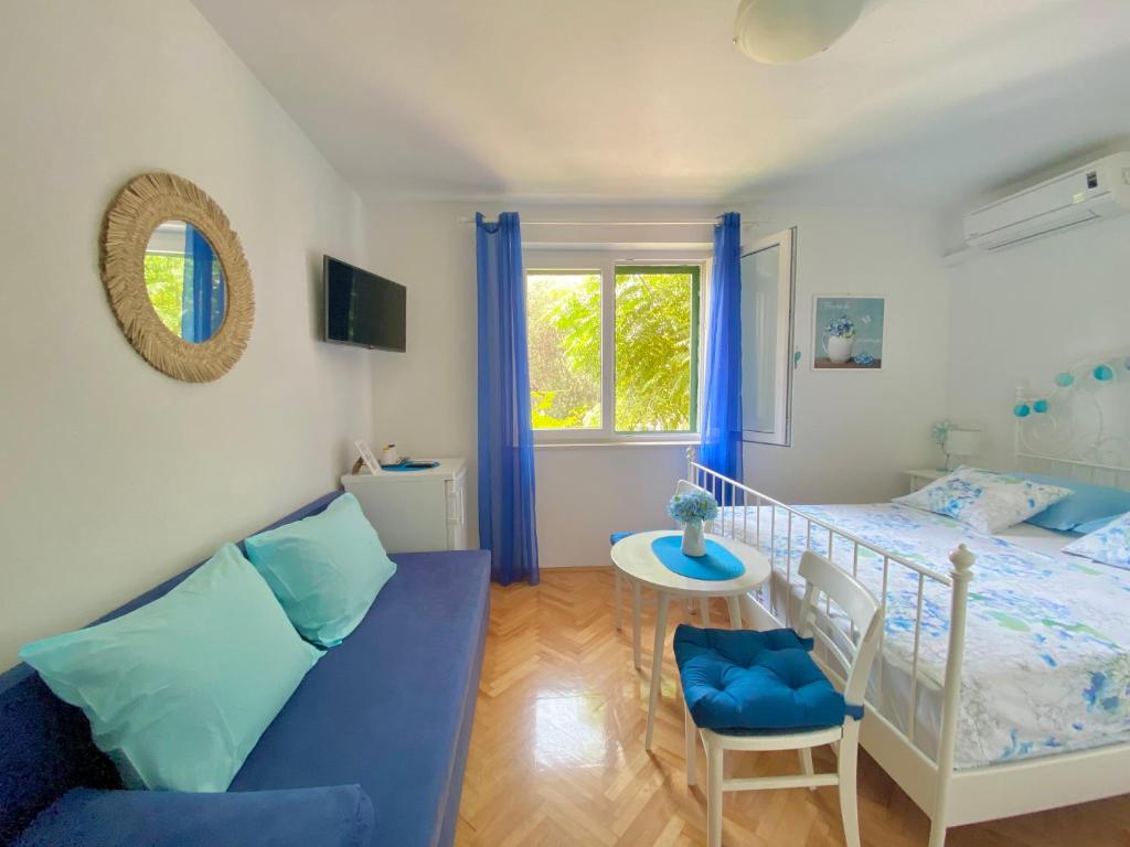 Postel nebo postele na pokoji v ubytování Apartmani Marko