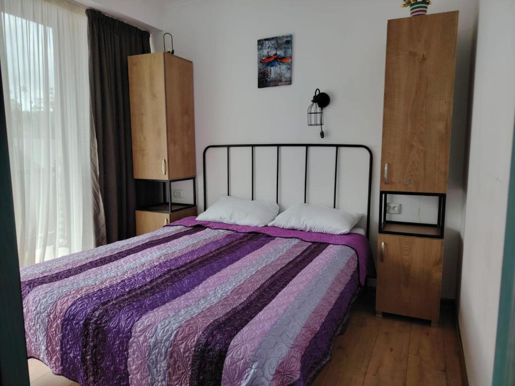 Postel nebo postele na pokoji v ubytování Apart Hotel ART