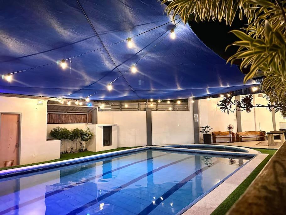 a swimming pool in a house with a ceiling at Resort in Los Banos near Pansol in Los Baños