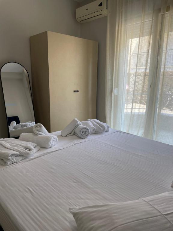 Postel nebo postele na pokoji v ubytování Kaza Oasis