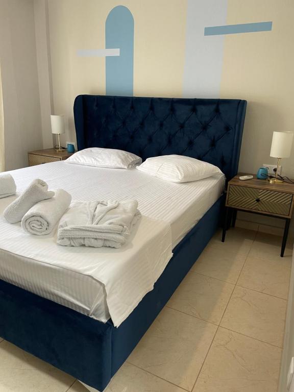 Postel nebo postele na pokoji v ubytování Kaza Oasis