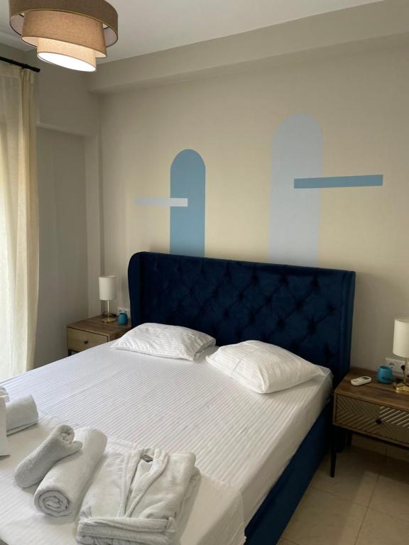 Postel nebo postele na pokoji v ubytování Kaza Oasis