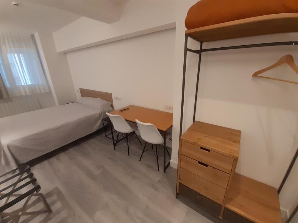 Postel nebo postele na pokoji v ubytování Hotel Photo Zabalburu