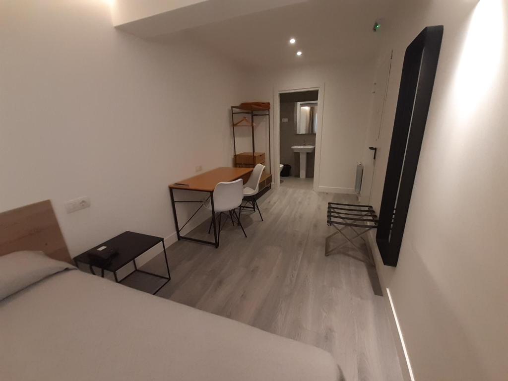 Postel nebo postele na pokoji v ubytování Hotel Photo Zabalburu