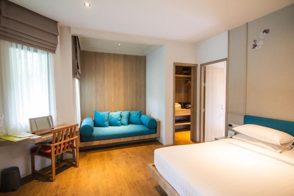Postel nebo postele na pokoji v ubytování Bann Pantai Resort