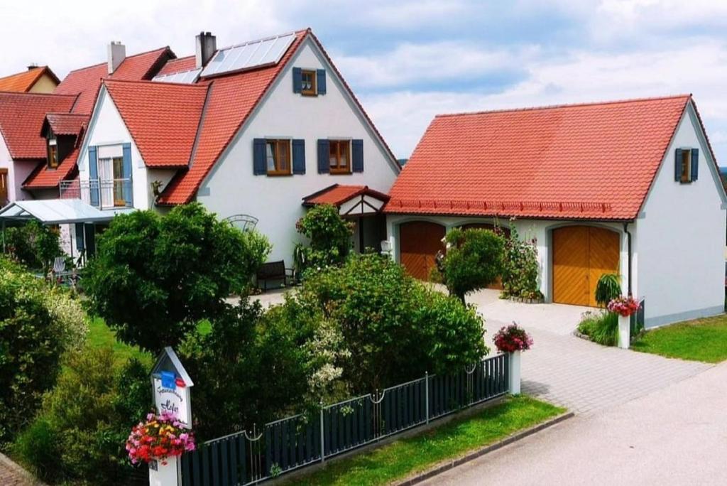 a house with an orange roof at Ferienwohnung Hofer in Spalt