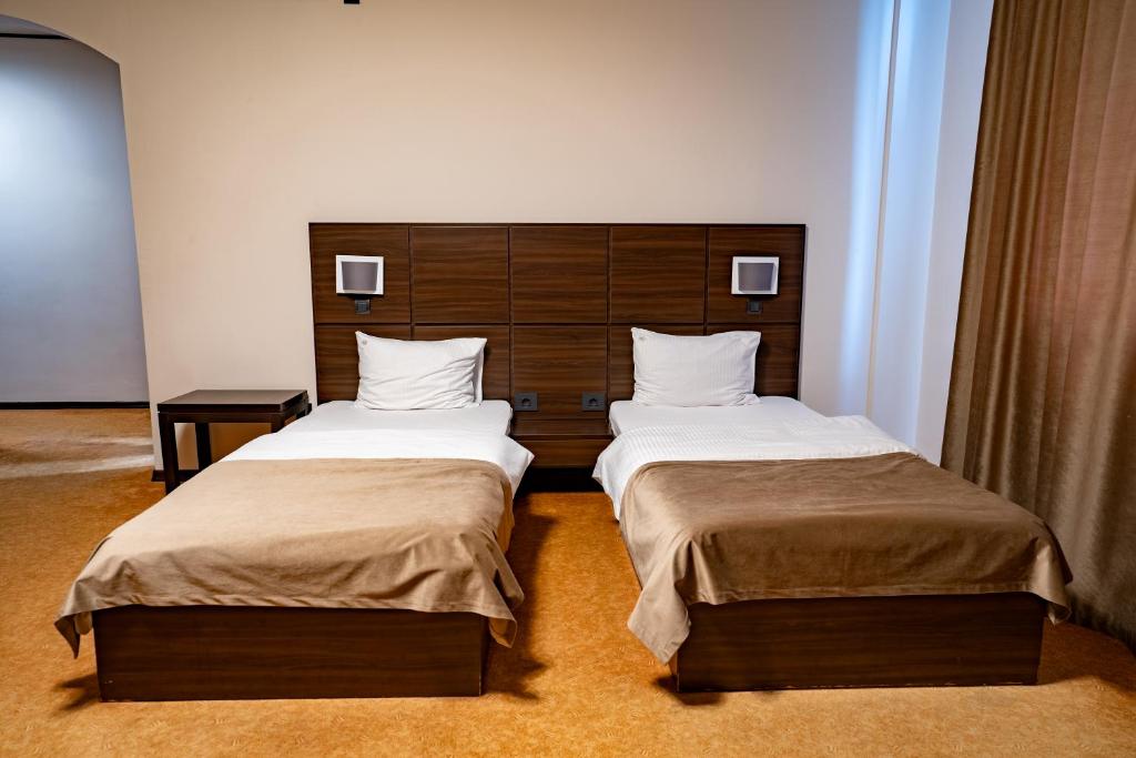 Postel nebo postele na pokoji v ubytování Hotel Aurelia