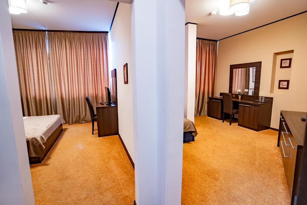 Postel nebo postele na pokoji v ubytování Hotel Aurelia