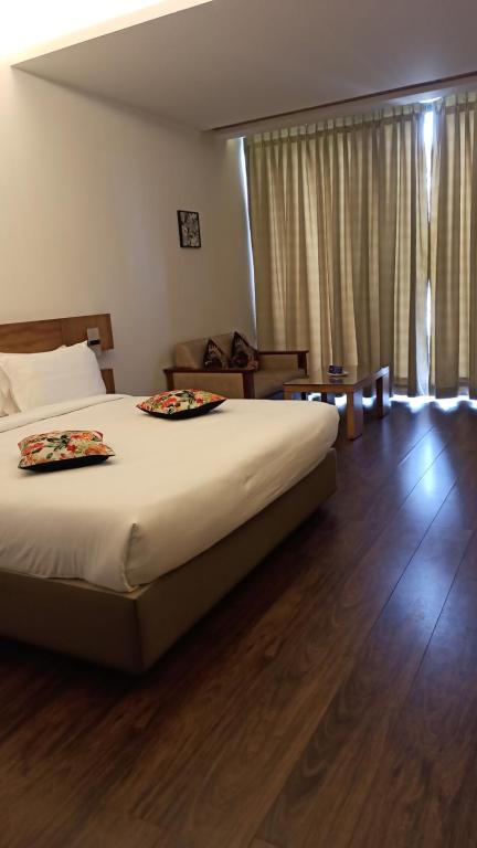 Postel nebo postele na pokoji v ubytování Mountain Retreat Kodai