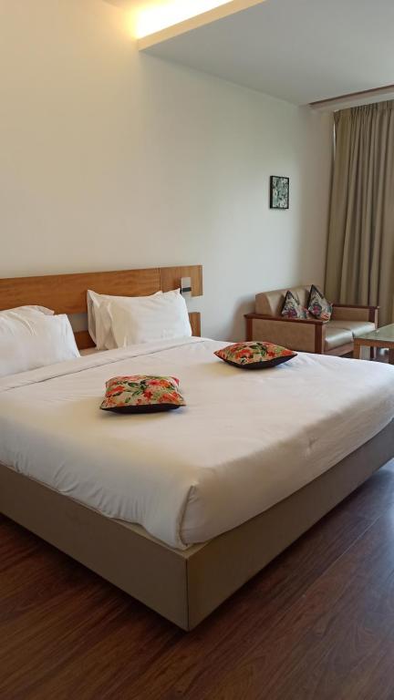 Postel nebo postele na pokoji v ubytování Mountain Retreat Kodai