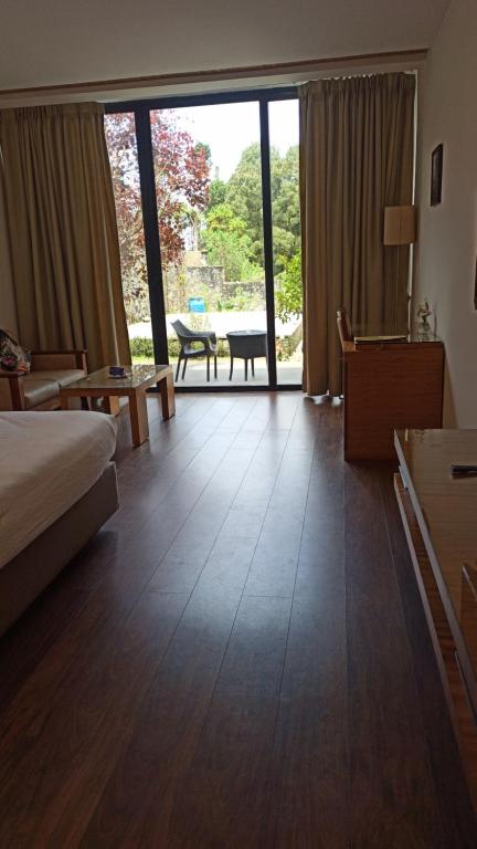 Postel nebo postele na pokoji v ubytování Mountain Retreat Kodai