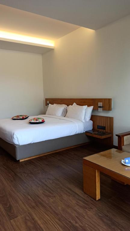 Postel nebo postele na pokoji v ubytování Mountain Retreat Kodai