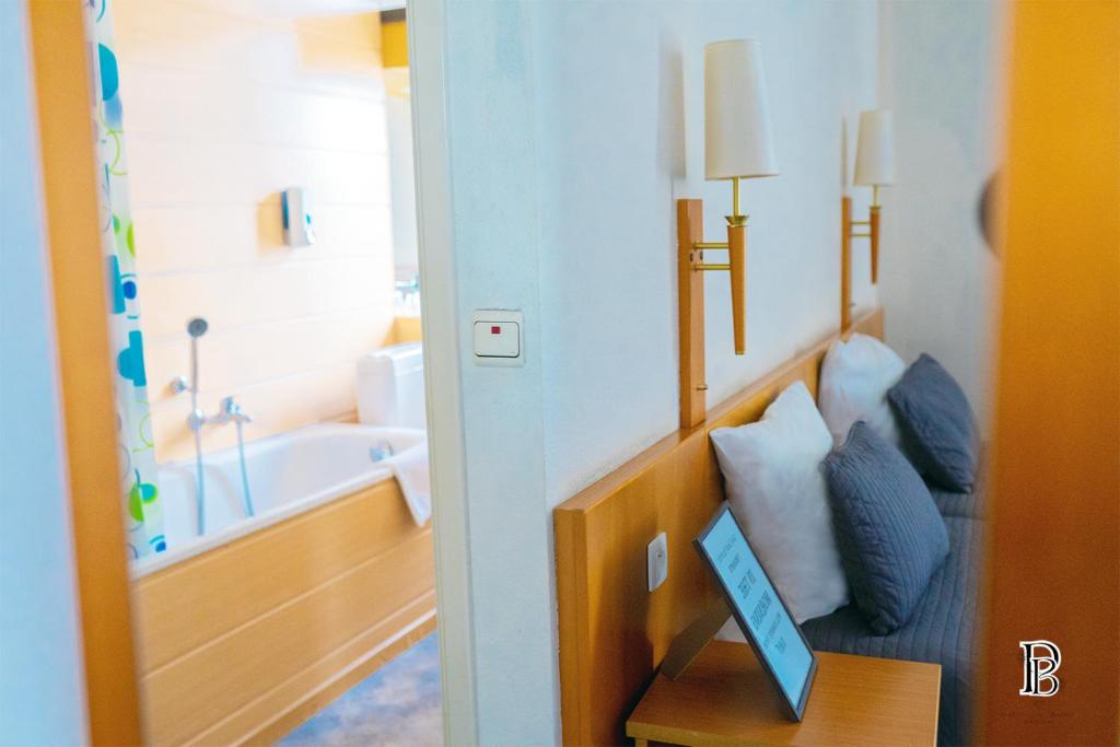 Postel nebo postele na pokoji v ubytování Hotel Professor Leuven Centrum
