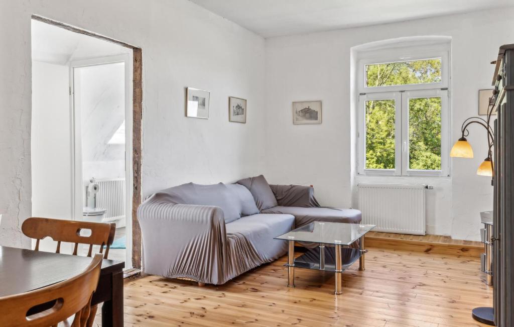 a living room with a couch and a table at Ferienwohnung Daniela in Rambin