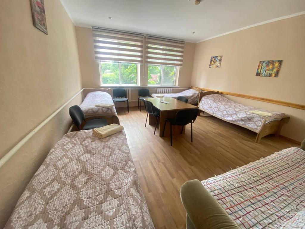 Postel nebo postele na pokoji v ubytování Tian-Shan Guest House