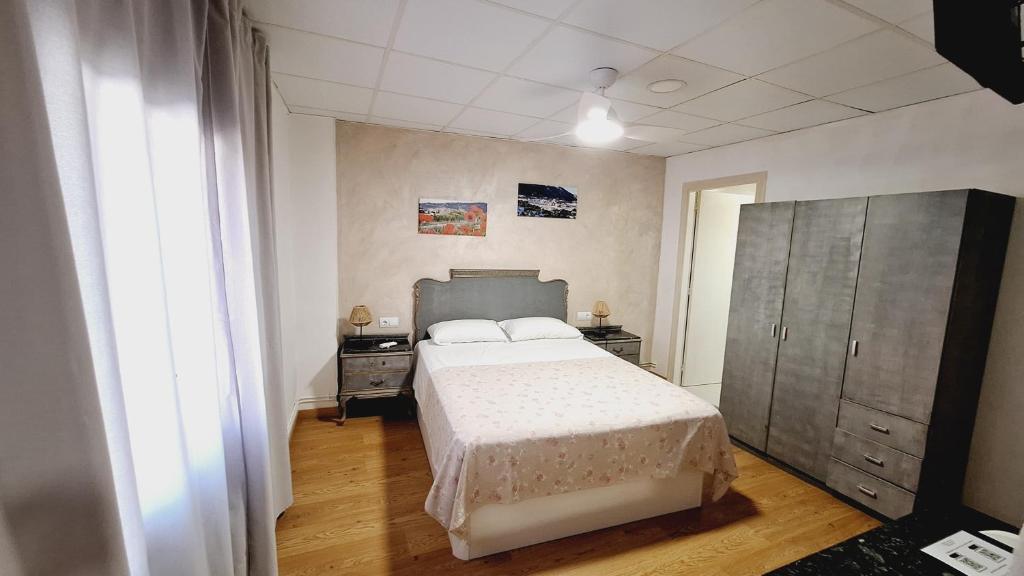 Postel nebo postele na pokoji v ubytování Fonda Toldra