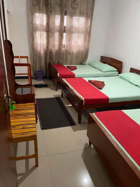 Postel nebo postele na pokoji v ubytování Olivia HomeStay
