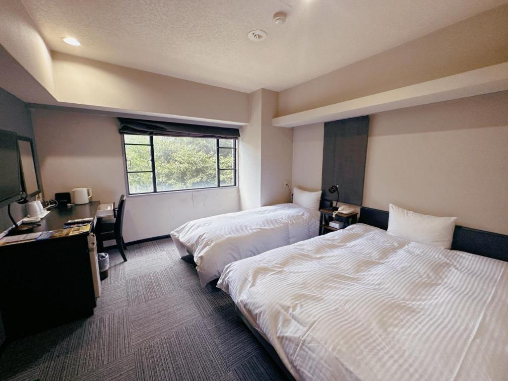 Postel nebo postele na pokoji v ubytování Nissay Hotel Fukuoka - Vacation STAY 80184v