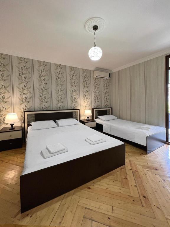 Postel nebo postele na pokoji v ubytování Savane hotel