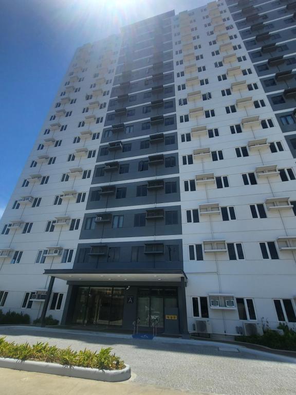 a large white apartment building with the door open at Condo in Iloilo City - SMDC Style Residence in Iloilo City