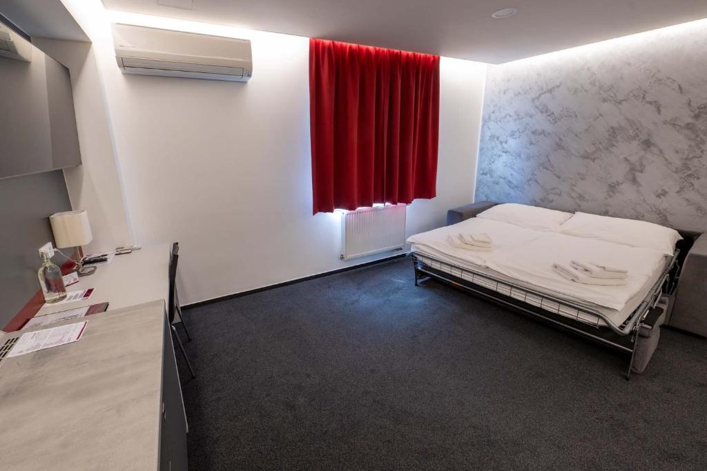 Postel nebo postele na pokoji v ubytování Hotel Villa Eden