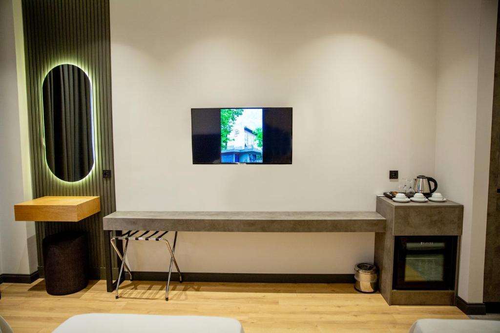 TV a/nebo společenská místnost v ubytování ÖZEN HOTEL