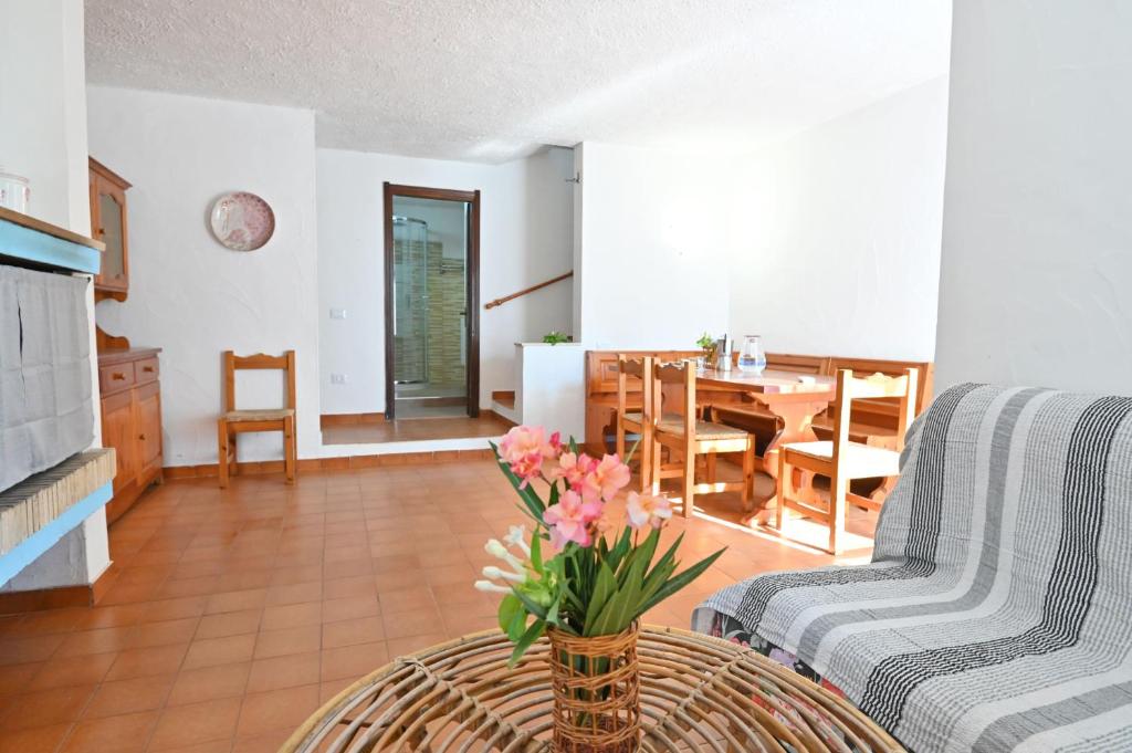 a living room with a couch and a table at Villa Gioia in Costa Rei