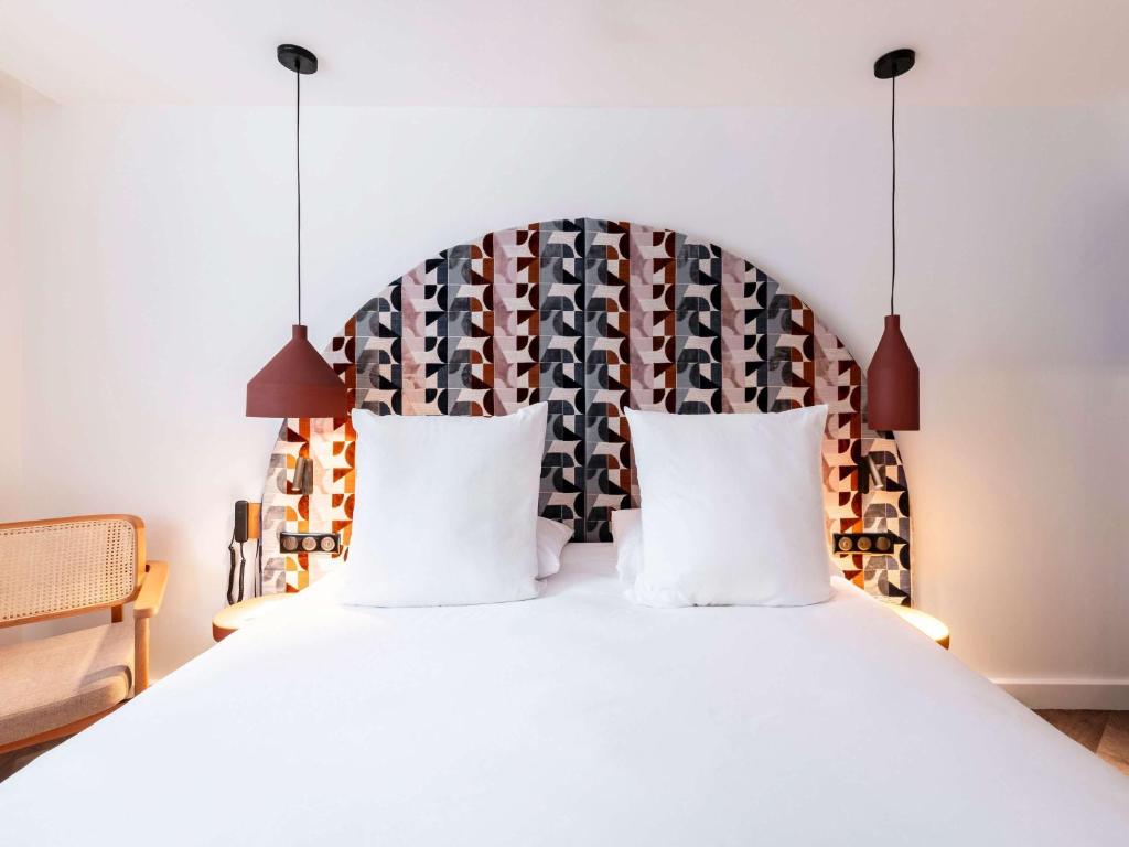 Postel nebo postele na pokoji v ubytování Mercure Quiberon Hotel
