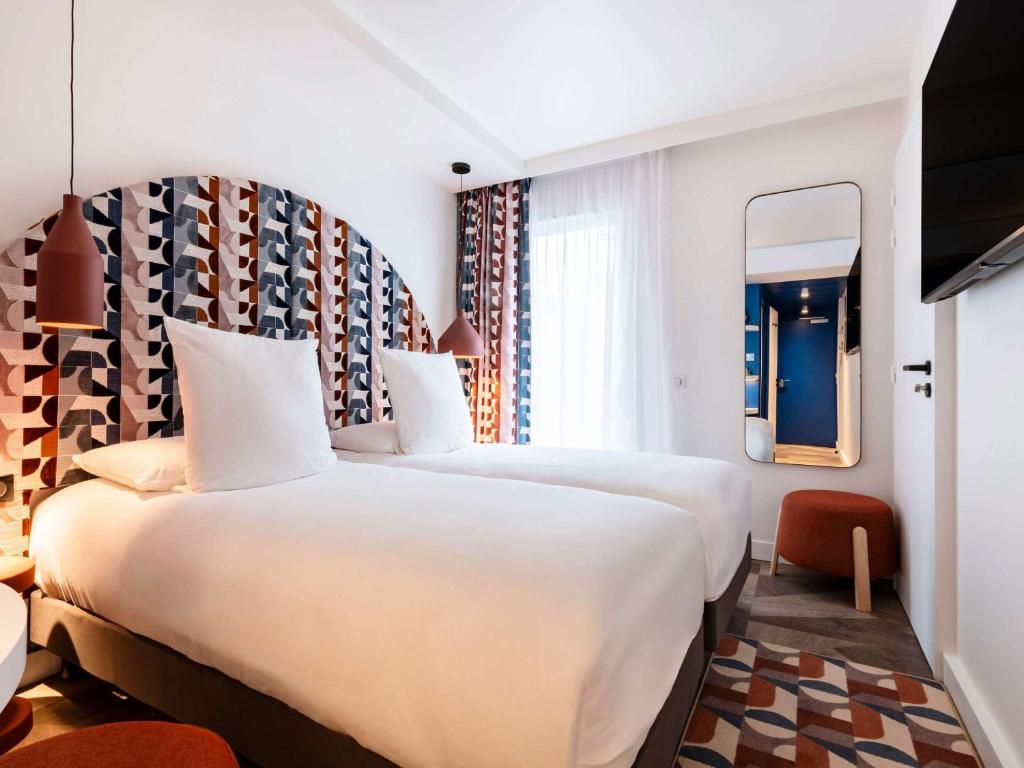 Postel nebo postele na pokoji v ubytování Mercure Quiberon Hotel